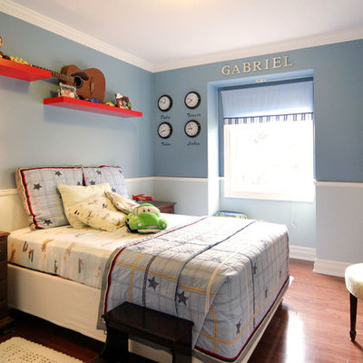 Trendy boy kids' room photo in Toronto with blue walls