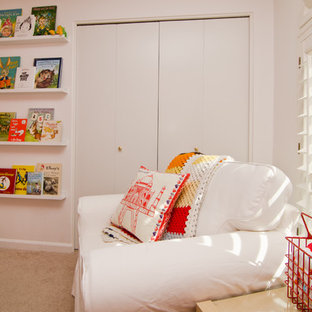 Example of a mid-sized minimalist gender-neutral carpeted kids' room design in Phoenix with white walls