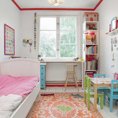 Inspiration for a mid-sized eclectic gender-neutral painted wood floor kids' room remodel in Stockholm with white walls