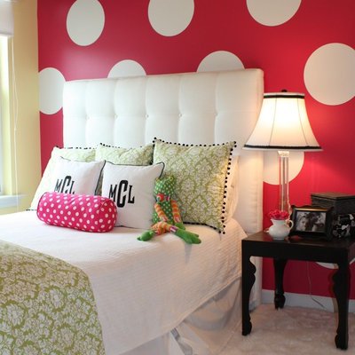 Inspiration for a contemporary girl carpeted kids' room remodel in Charlotte with multicolored walls
