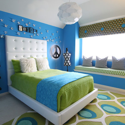 Kids' room - contemporary girl carpeted kids' room idea in Dallas with blue walls