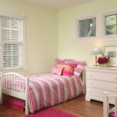 Mid-sized elegant girl medium tone wood floor kids' room photo in Chicago with green walls