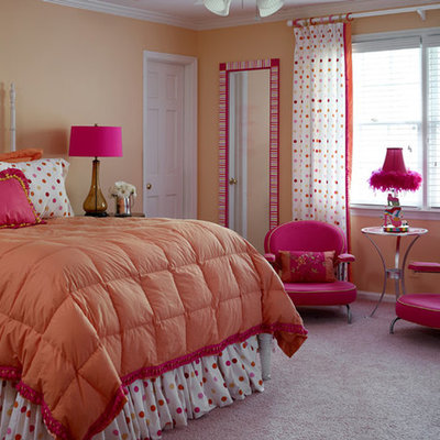 Example of a classic girl carpeted kids' bedroom design in Atlanta with orange walls