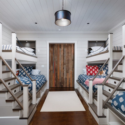 Transitional gender-neutral kids' room photo in Other with white walls