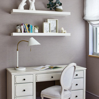 Example of a mid-sized transitional girl medium tone wood floor and brown floor kids' room design in Los Angeles with purple walls