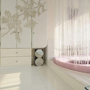 Example of a trendy girl kids' room design in Indianapolis with white walls