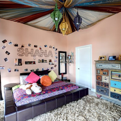 Inspiration for a mid-sized eclectic girl carpeted and gray floor kids' room remodel in Atlanta with pink walls