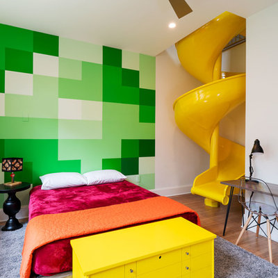 Kids' bedroom - mid-sized contemporary medium tone wood floor and brown floor kids' bedroom idea in Austin with green walls