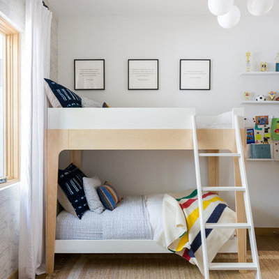 Inspiration for a mid-sized contemporary gender-neutral light wood floor and brown floor kids' room remodel in Los Angeles with white walls