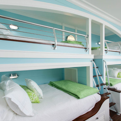 Kids' room - coastal gender-neutral dark wood floor and brown floor kids' room idea in Other with blue walls