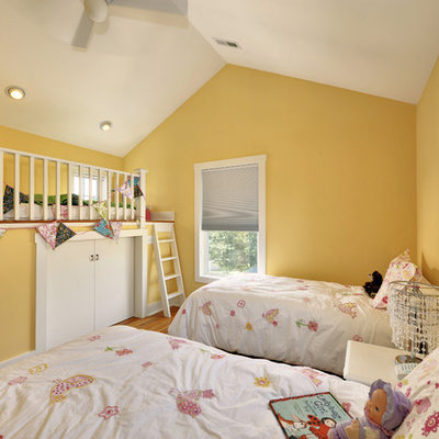 Example of a classic girl kids' room design in Philadelphia with yellow walls