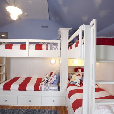 Example of a classic gender-neutral medium tone wood floor kids' room design in Tampa with blue walls
