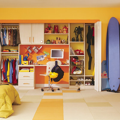 Example of a classic boy multicolored floor kids' room design in New York with yellow walls