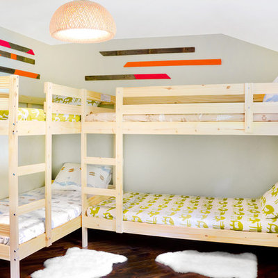Example of a mountain style gender-neutral dark wood floor kids' room design in Portland Maine with gray walls