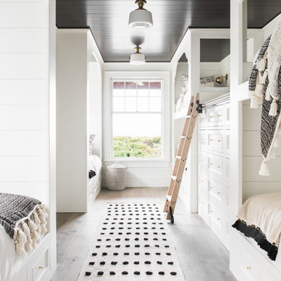 Beach style gender-neutral kids' room photo in Charleston with white walls