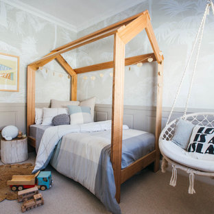 Design ideas for a mid-sized transitional kids' bedroom for kids 4-10 years old and girls in Sydney with grey walls, carpet and grey floor.