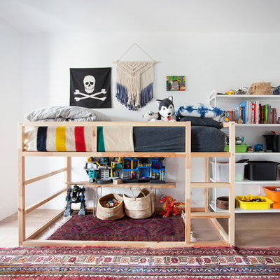 Inspiration for a 1950s boy dark wood floor kids' room remodel in Los Angeles with white walls