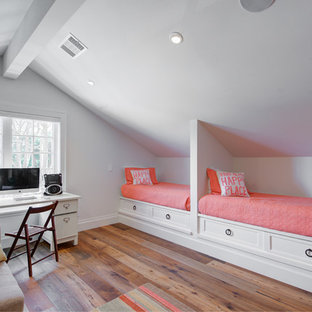 Inspiration for a farmhouse girl medium tone wood floor and brown floor kids' bedroom remodel in San Francisco with white walls