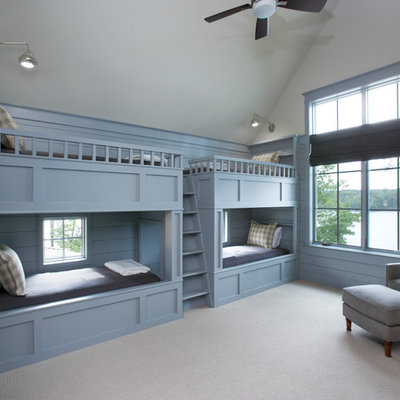 Example of a beach style gender-neutral carpeted and gray floor kids' room design in Other with blue walls