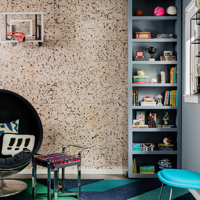 Inspiration for a large modern boy medium tone wood floor and brown floor kids' room remodel in New York with blue walls
