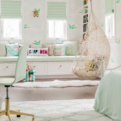 Large transitional girl light wood floor and brown floor kids' room photo in New York with multicolored walls