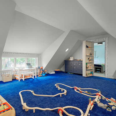 Inspiration for a large transitional boy carpeted, vaulted ceiling and blue floor kids' room remodel in Chicago with white walls