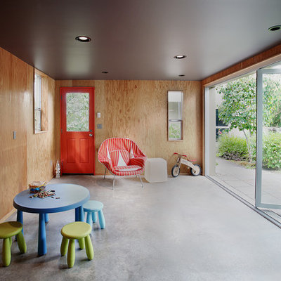 Inspiration for a mid-sized mid-century modern gender-neutral concrete floor kids' room remodel in Seattle