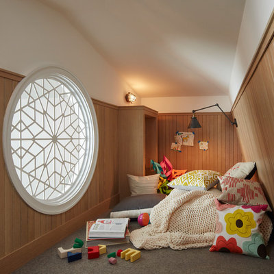 Example of a transitional gender-neutral carpeted and gray floor kids' room design in Chicago with white walls