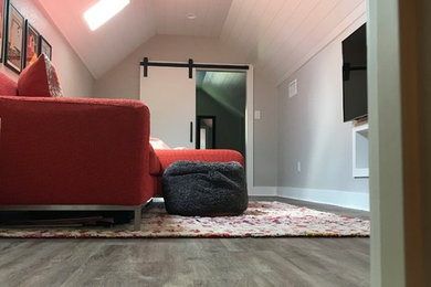 Small transitional vinyl floor and brown floor playroom photo in Austin with gray walls