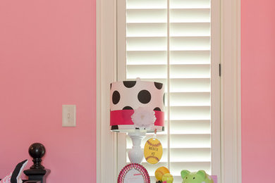 Kids' room - traditional girl kids' room idea in New Orleans with pink walls
