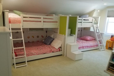Example of a mid-sized transitional gender-neutral carpeted and beige floor kids' room design in Boston with beige walls