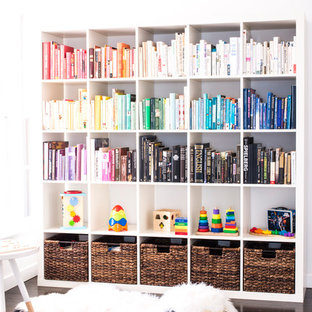 Kids' room - small contemporary gender-neutral dark wood floor kids' room idea in Los Angeles with white walls