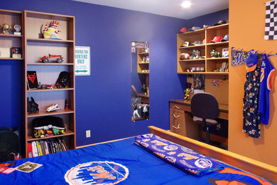 Mid-sized eclectic boy kids' room photo in New York with blue walls