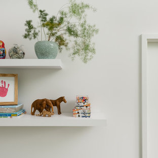 Inspiration for a small scandinavian boy carpeted and beige floor kids' room remodel in Seattle with white walls