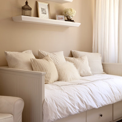 Example of a transitional gender-neutral dark wood floor kids' room design in Boise with beige walls