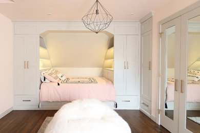 Kids' room - mid-sized transitional girl dark wood floor and brown floor kids' room idea in Calgary with pink walls
