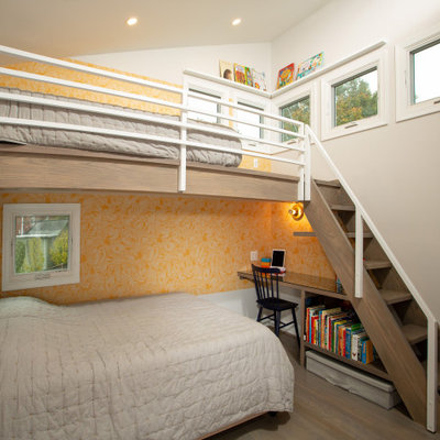Mid-sized trendy gender-neutral brown floor kids' room photo in DC Metro with gray walls