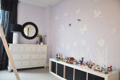 Medium sized classic children’s room for girls in Vancouver with purple walls.
