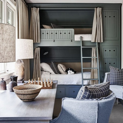 Example of a small transitional gender-neutral carpeted kids' room design in Charlotte with white walls