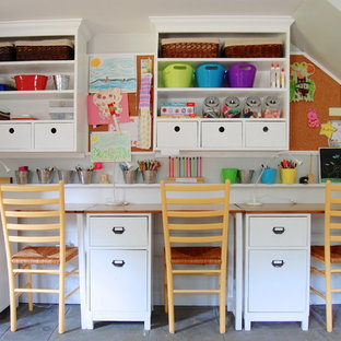 Example of a farmhouse gender-neutral kids' study room design in New York with white walls