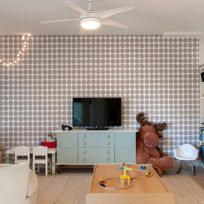 Inspiration for a contemporary boy light wood floor playroom remodel in Vancouver with multicolored walls