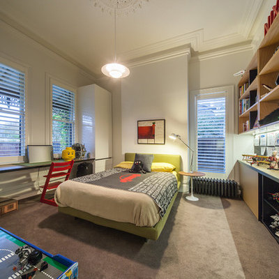 Example of a trendy boy carpeted kids' bedroom design in Melbourne with white walls