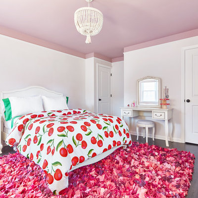 Example of a mid-sized trendy girl dark wood floor kids' room design in New York with pink walls