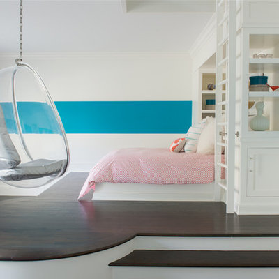 Inspiration for a large transitional girl dark wood floor and brown floor kids' room remodel in New York with multicolored walls