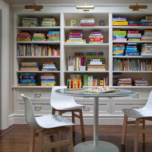 Example of a trendy kids' room design in New York with gray walls