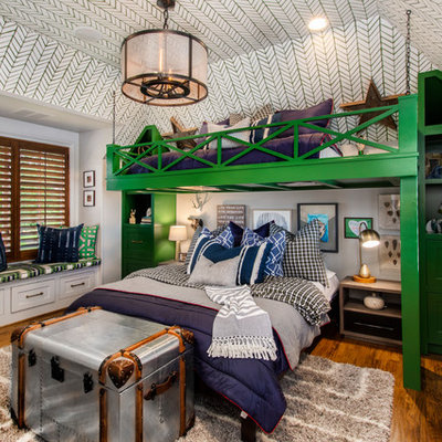 Kids' room - mid-sized traditional boy medium tone wood floor kids' room idea in Dallas with multicolored walls