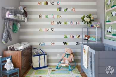 Design ideas for a medium sized traditional gender neutral toddler’s room in Philadelphia with grey walls and light hardwood flooring.