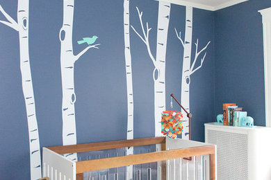 Kids' room - mid-sized eclectic gender-neutral medium tone wood floor kids' room idea in Boston with blue walls