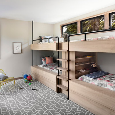 Example of a large trendy gender-neutral carpeted kids' room design in San Francisco with gray walls