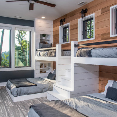 Large mountain style gender-neutral gray floor and carpeted kids' room photo in Other with brown walls